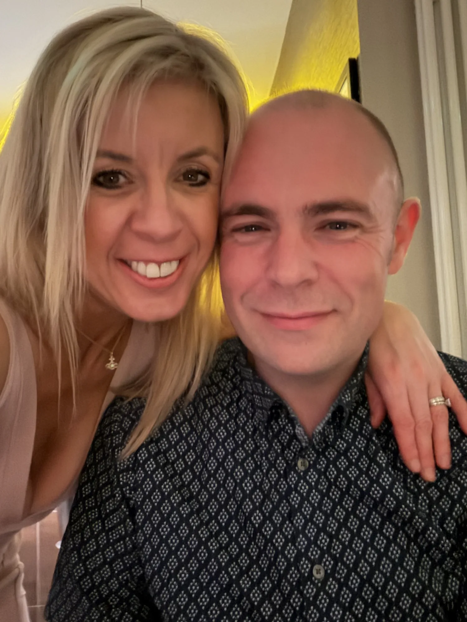 Shay Ward, founder of Current Contractors, with his wife